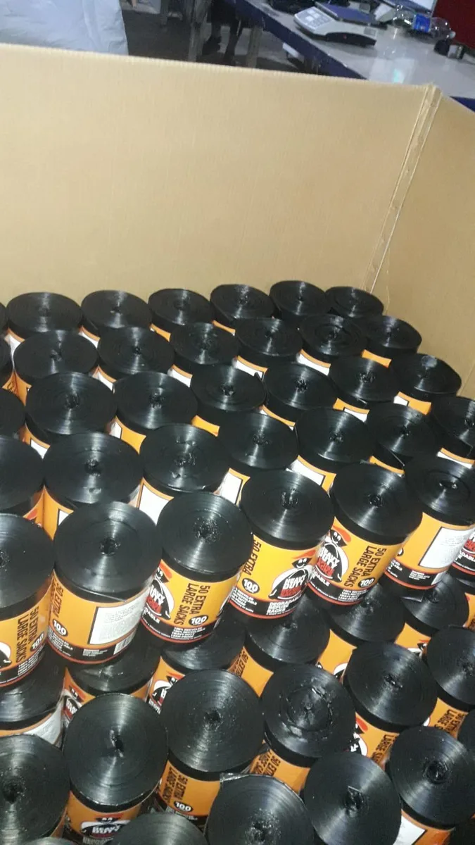 Export carton filled with printed black bin bag rolls