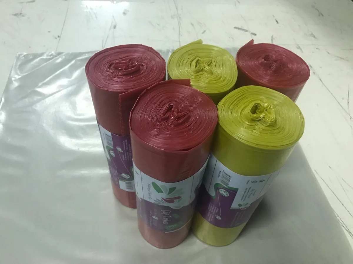 Red and green scented bin liner rolls with retail labels