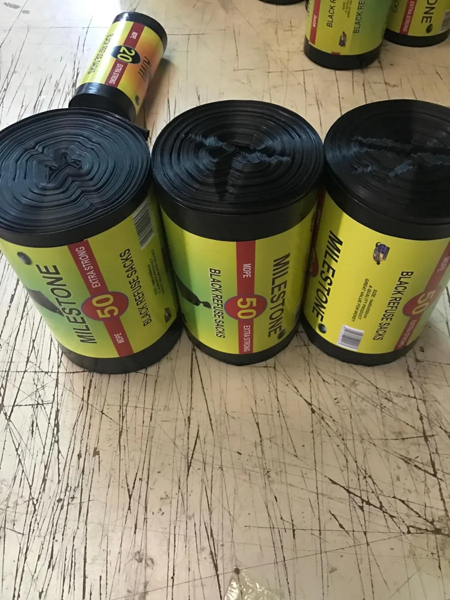 Private label black refuse sack rolls with printed labels